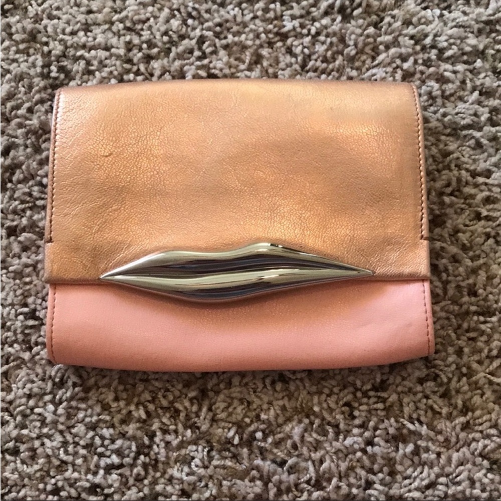 Can be a clutch or a cross body